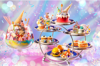 A group of desserts on a stand

Description automatically generated