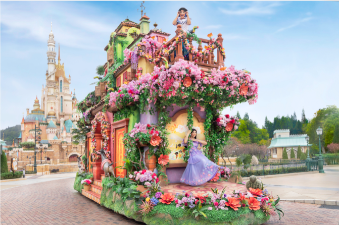 A person in a purple dress on a float with flowers on the roof

Description automatically generated